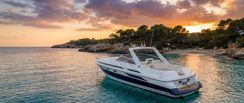 Yacht at speed along the coast