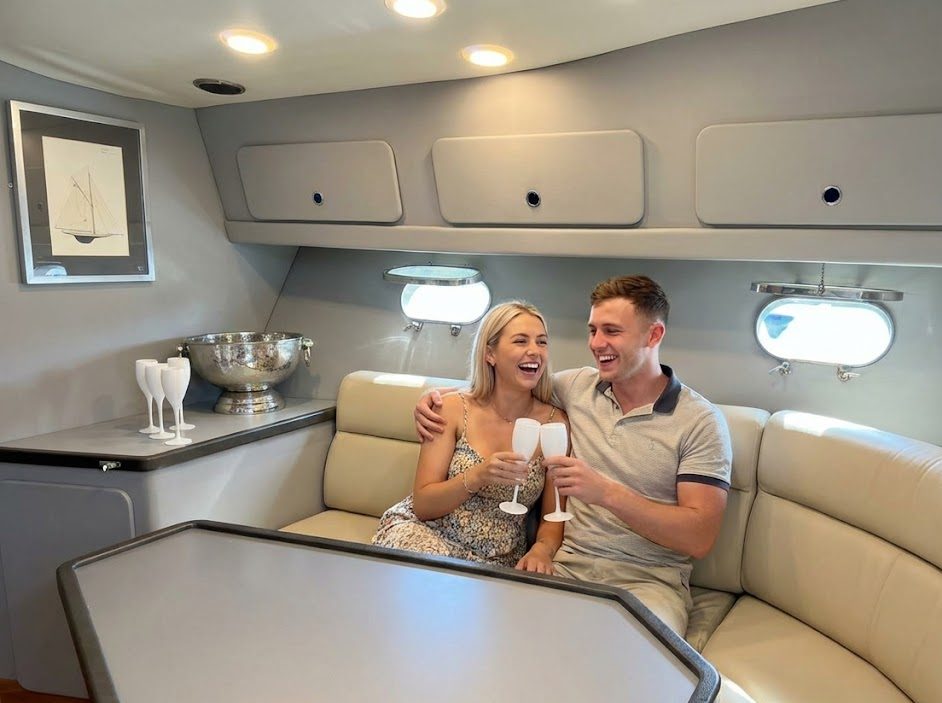 Couple enjoying champagne in the saloon